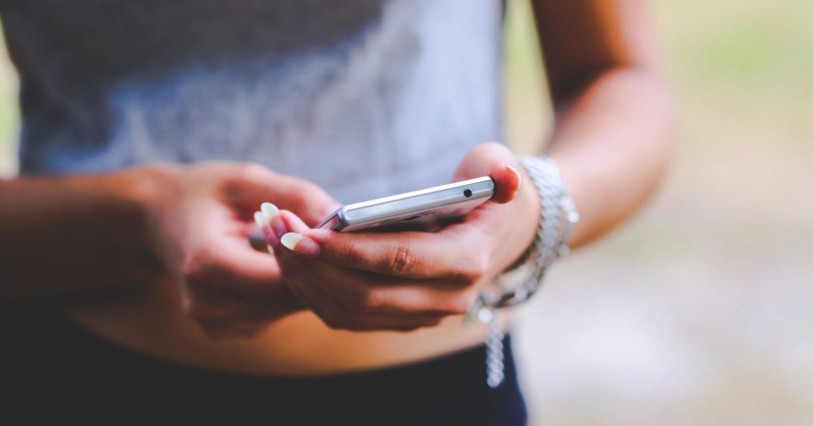 Woman checking her smartphone_Revu Philippines